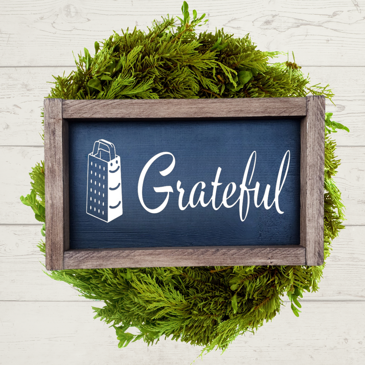 5x9 framed kitchen sign with a black background and white lettering that says grateful with a cheese grater